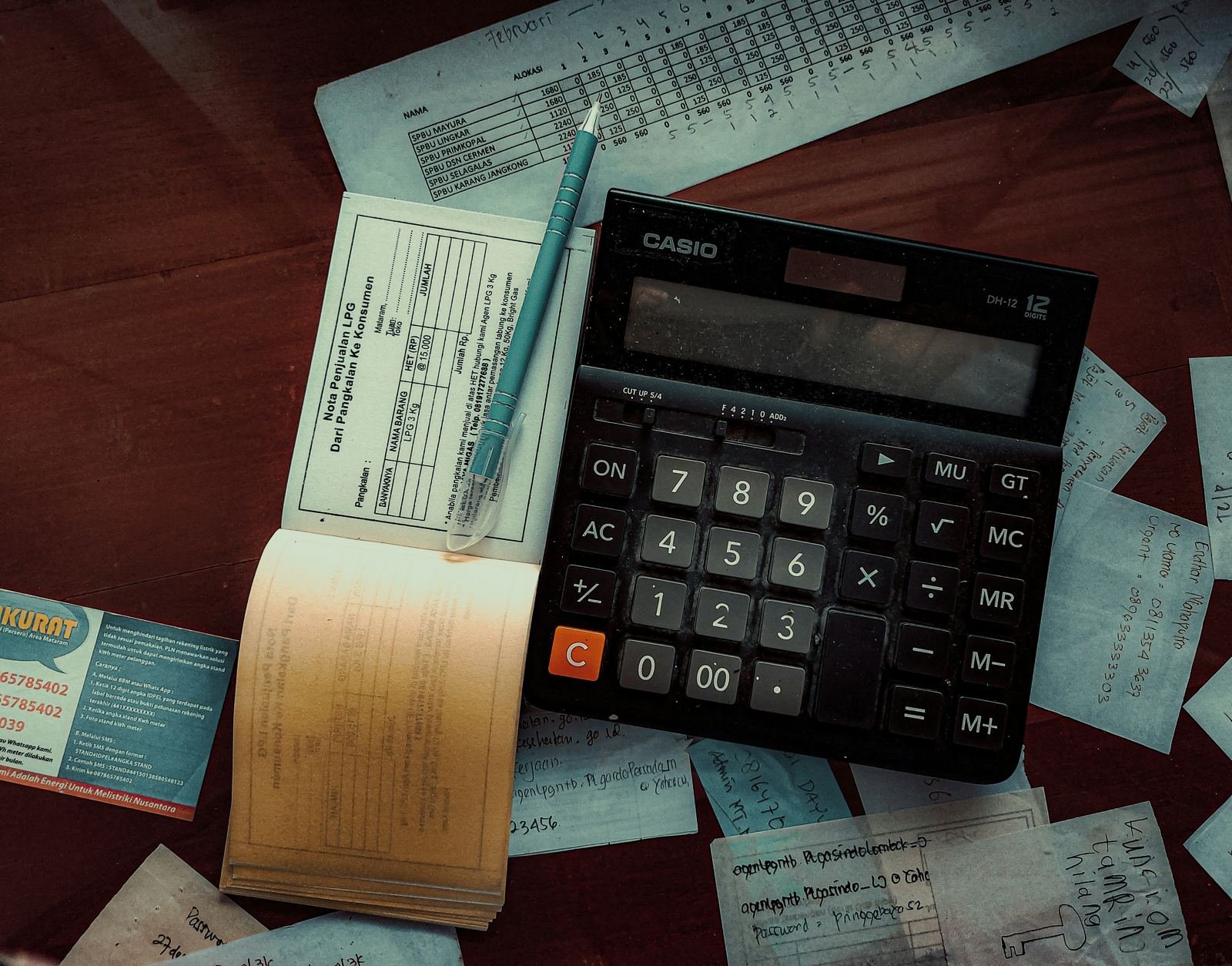 Calculator, receipts and invoices on an accounting desk
