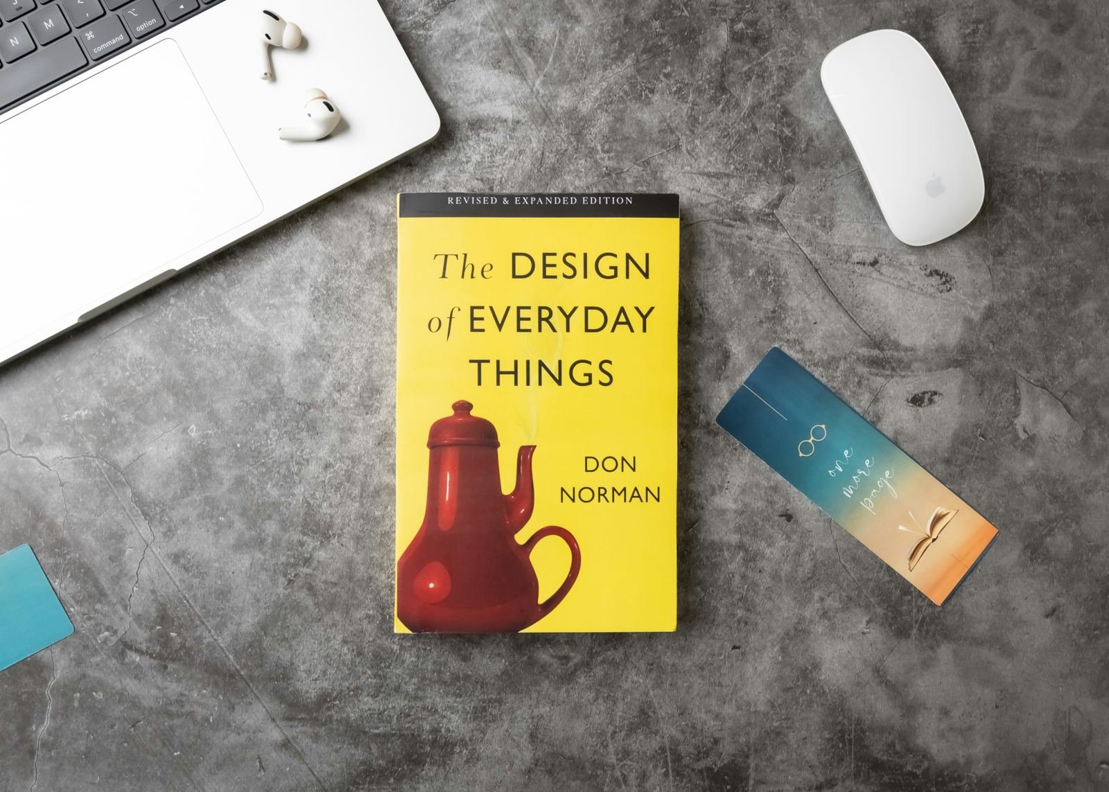 A printed book on a desk beside a laptop, representing eBook and book publishing